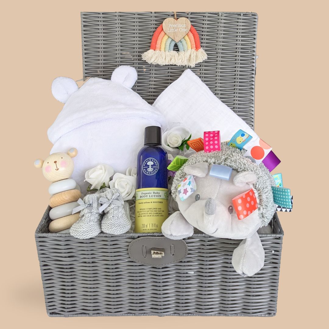 new baby gifts in a hamper basket.