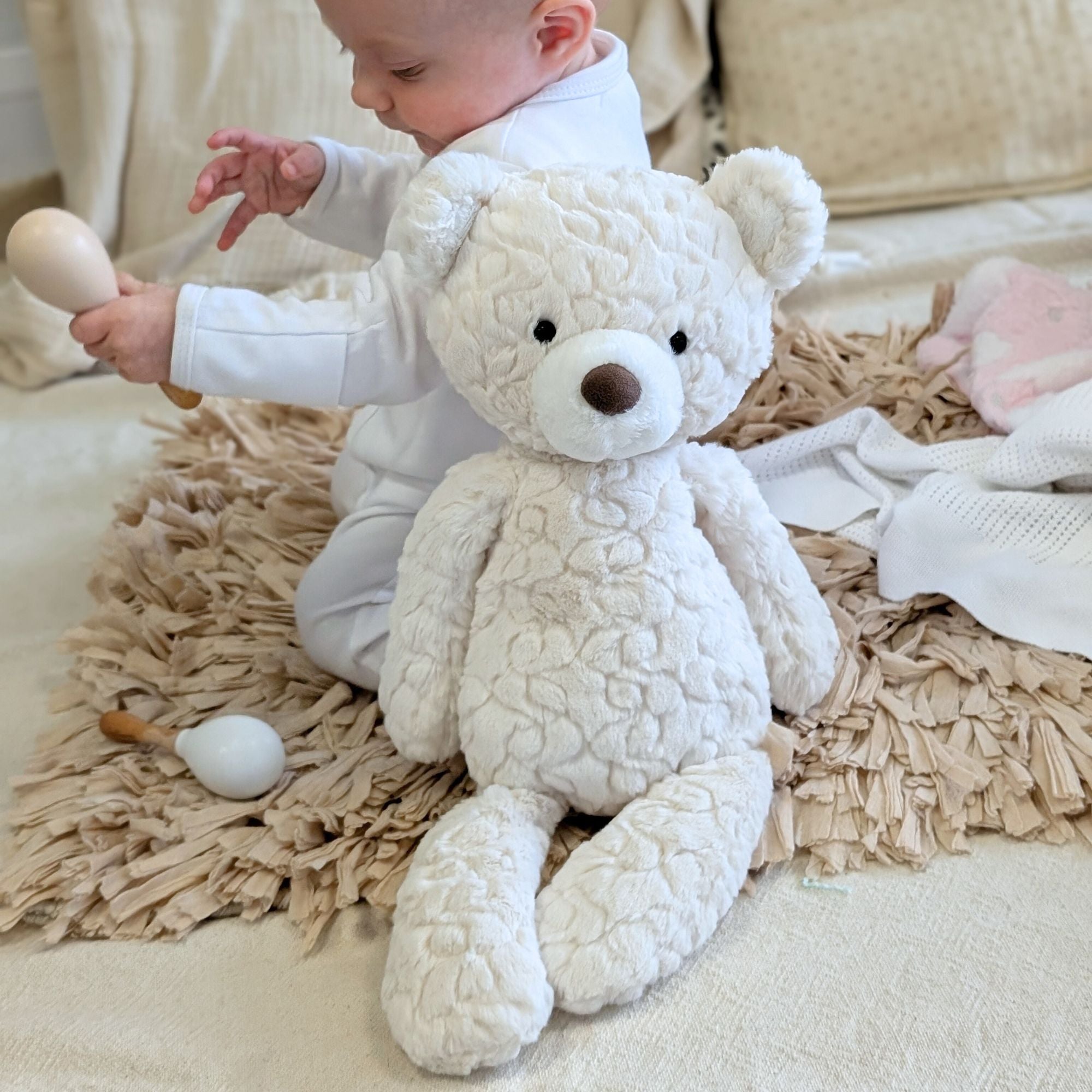 White teddy bear with a baby.
