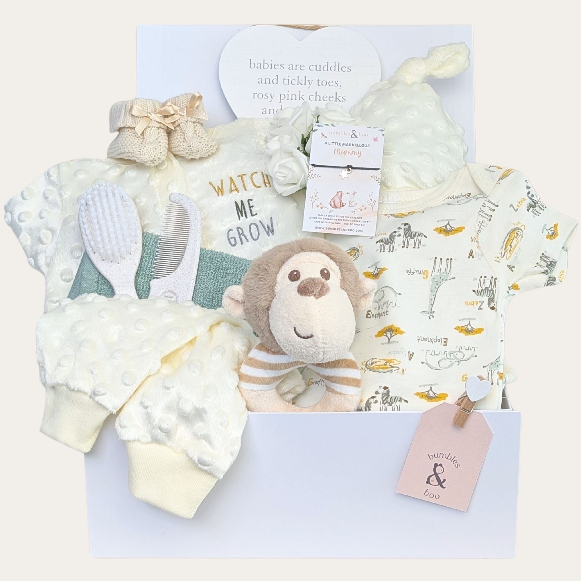 Baby shower gifts box with a clothing set and monkey. Hamper designed by Bumbles and Boo.