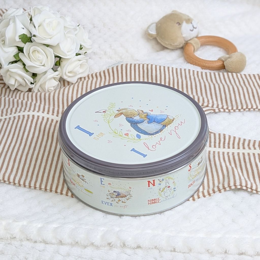 A Peter Rabbot themed tin containing delicoud biscuits and the sentiment I is for I Love You