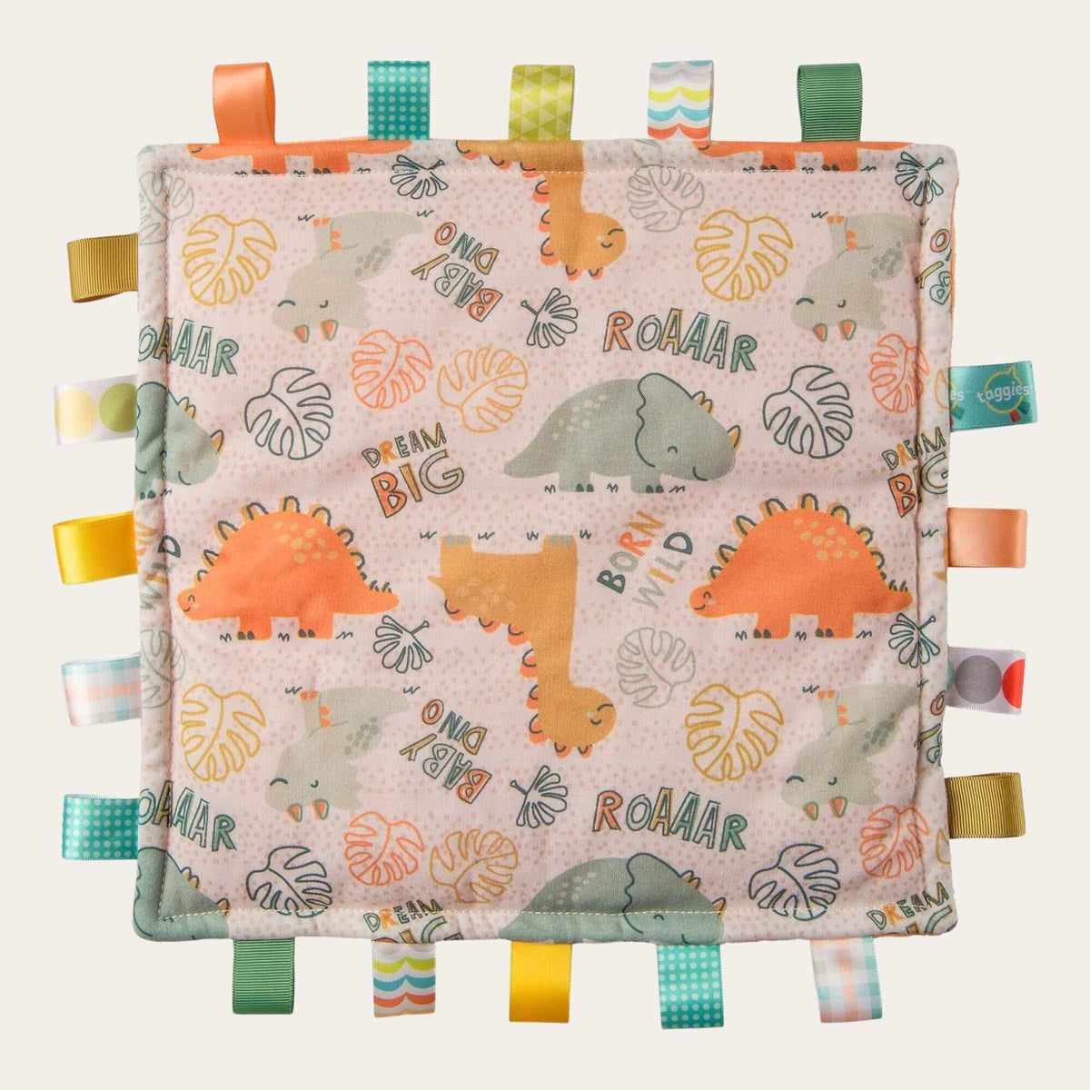 Bright dinosaur print soft taggie toy baby comforter from Mary Meyer in oranges and greens.