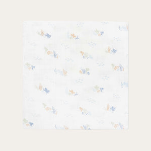 Organic baby muslin swaddle with soft costal pattern in pastel blue, coral and green on white. Avery Row.