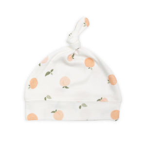 Peach design on white cute baby knot hat lulujo.