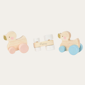 Push along wooden duck toy suitable from 12 months + baby and toddler gift toy. Available with pink, white or blue wheels.