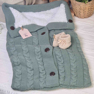Sage Green Cable Knit Baby Sleeping Pouch / Swaddle. Perfect for keeping babies snug and warm whilst they nap.