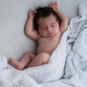 Lacy pale blue baby blanket shawl.