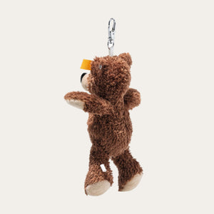 Brown teddy bear keychain with a yellow steiff label