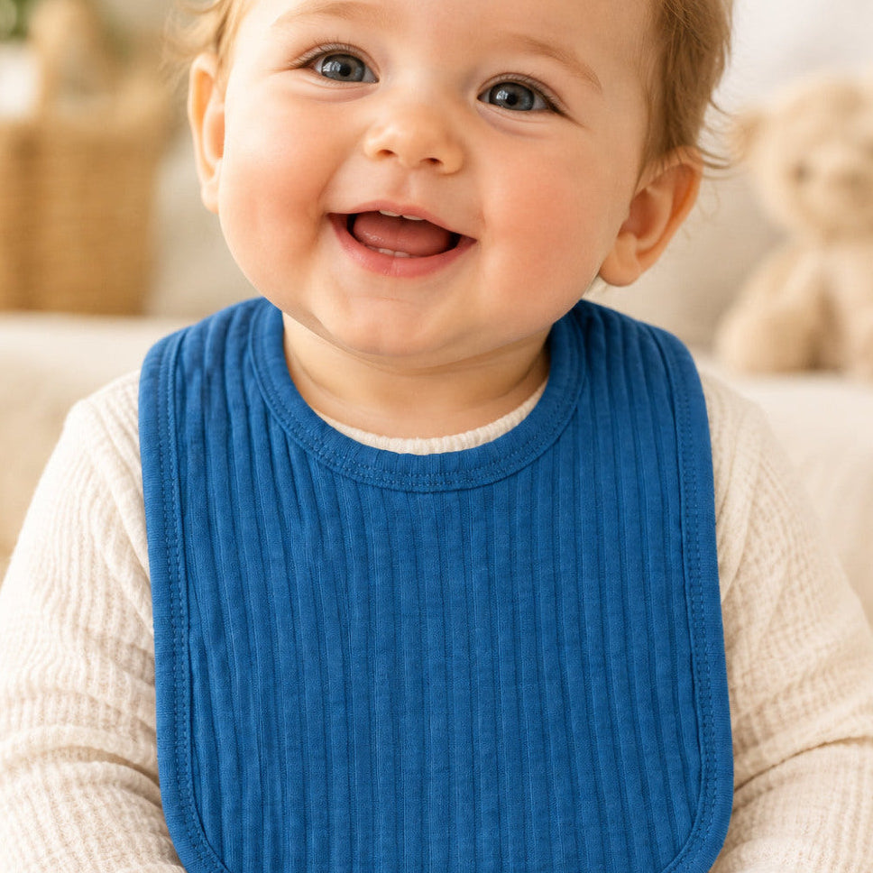 Azure blue cotton baby bib with Velcro fastening