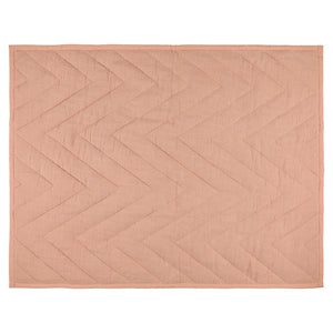 Baby blanket made from organic cotton in soft coral tones, suitable for nursery and everyday use