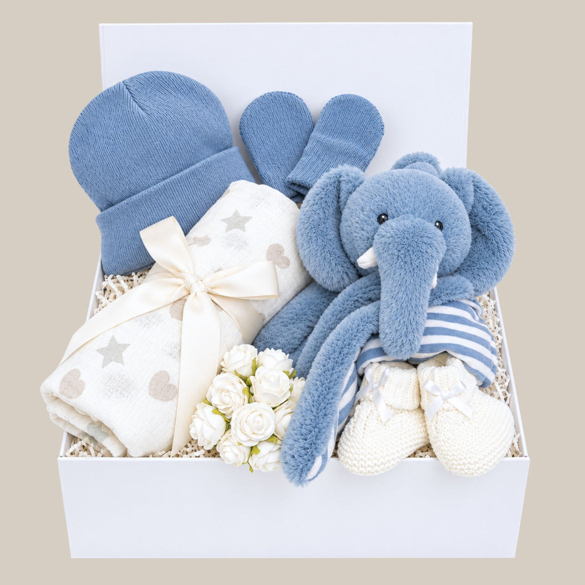 Baby boy gifts hamper with blue eco elephant comforter in a white gift box with blue baby accessories