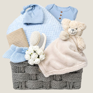 Newborn Baby boy gifts basket with blanket and blue clothes. Hamper by Bumbles and Boo.