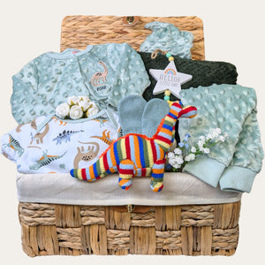 Personalised baby boy gifts hamper basket with a dinosaur theme. Bumbles and Boo.