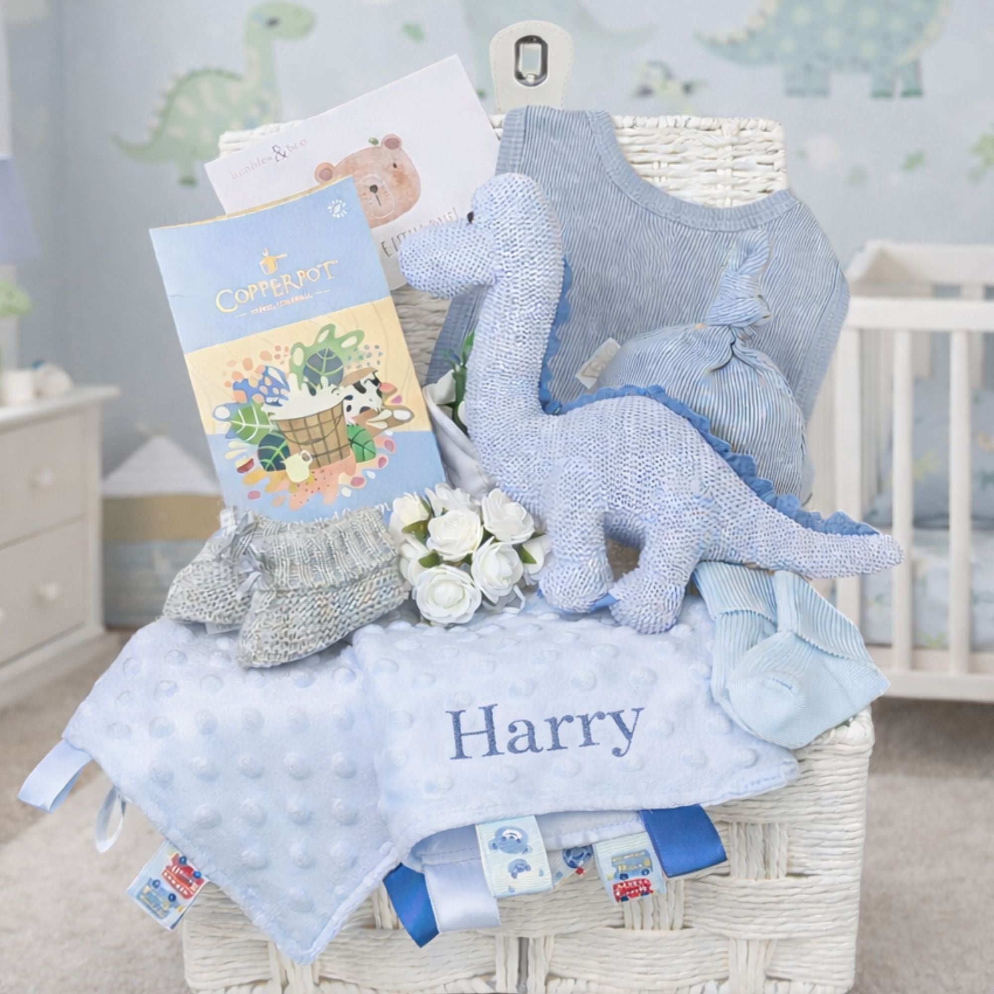 A personalised baby gift hamper full of presents to welcome a new baby boy.