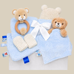 Baby boy gifts box with blue teddy theme and katie loxton hat and mittens set in a gift box.