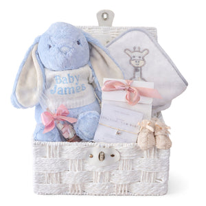 Baby boy hampers gift with blue personalised bunny and baby bath towel with a giraffe.