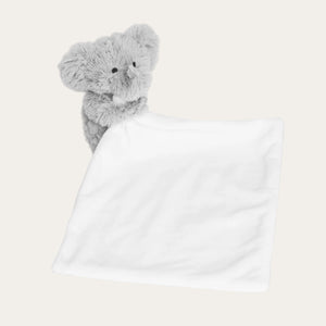 Elephant soft toy attached to baby comforter blanket