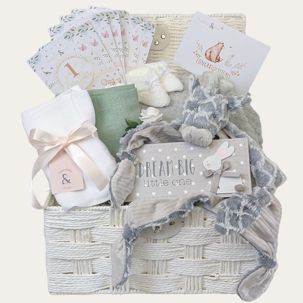 Luxury baby gifts hamper with giraffe comforter, personalised blanket, booties, and milestone cards – perfect new baby gift.