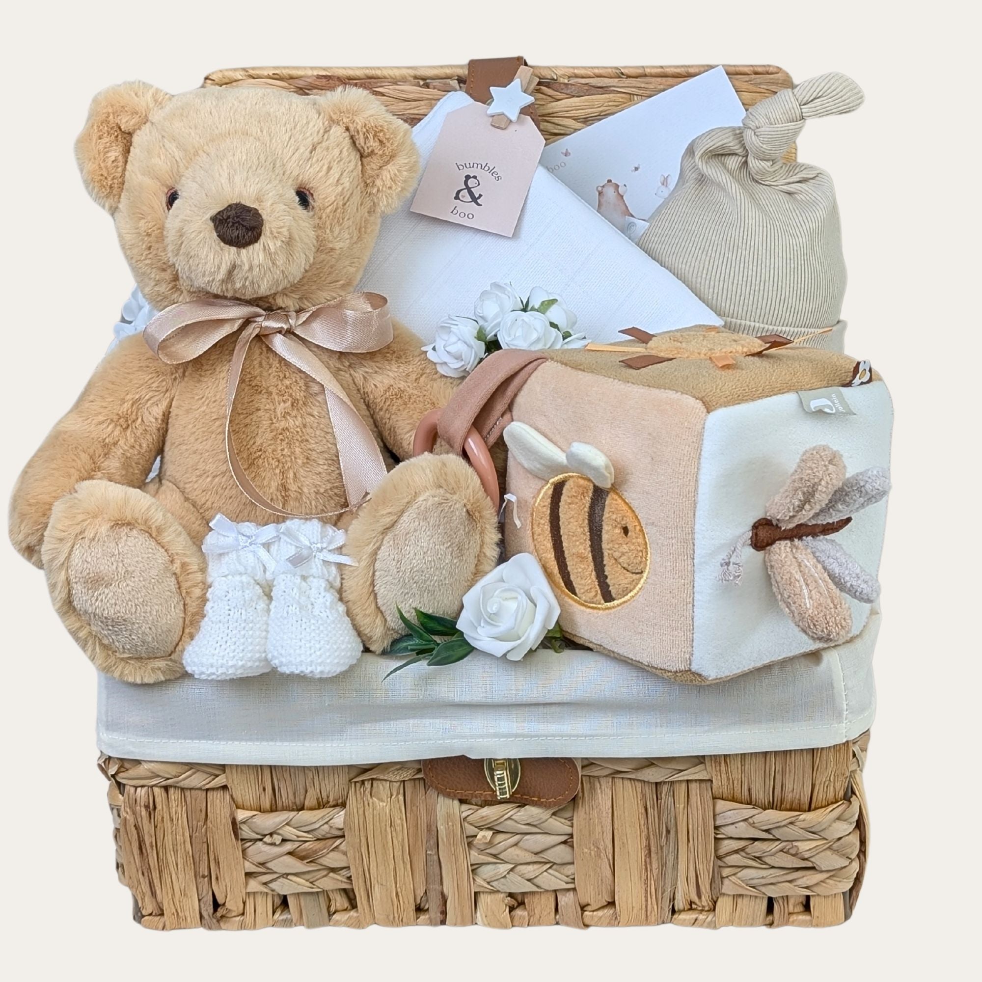 New baby gifts basket filled with presents including teddy bear and bumble bee activity cube. Packed in a hamper by Bumbles and Boo.