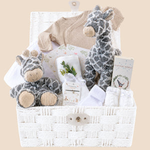 White baby gifts hamper with giraffe soft toy and matching giraffe comforter with hooded towel