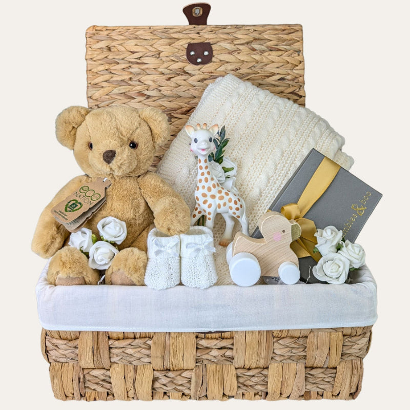 New baby hamper basket by Bumbles and Boo. Presents include teddy bear, baby blanket, wooden toy and gift for mum.