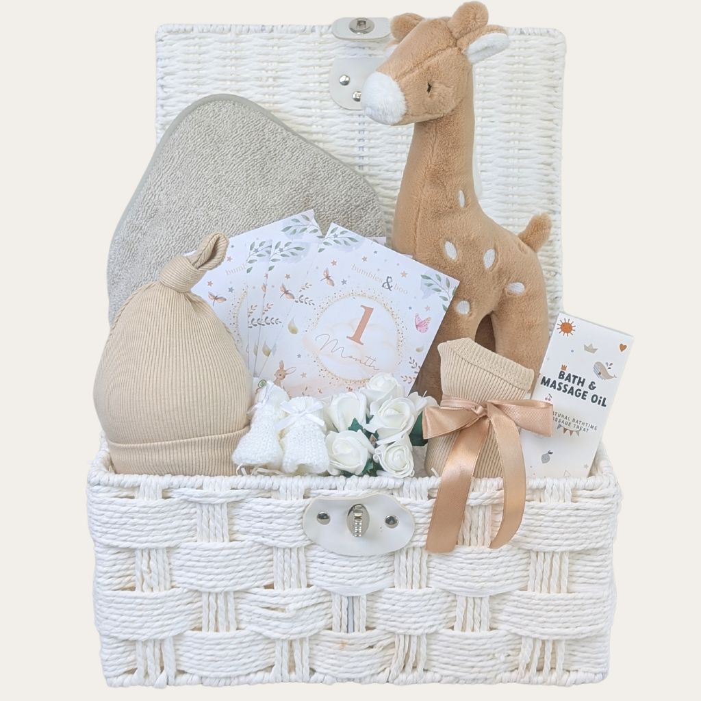 Bathtime themed new baby gift hamper with gorgeous giraffe toy. Keepsake basket full of presents and gifts to welcome new baby. Bumbles and Boo.