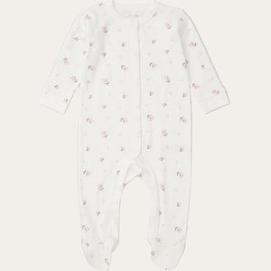 White baby onesie with pink floral pattern