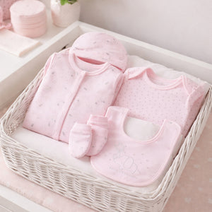 A pink baby girl clothing set with sleepsuit, bib, vest and hat matching set