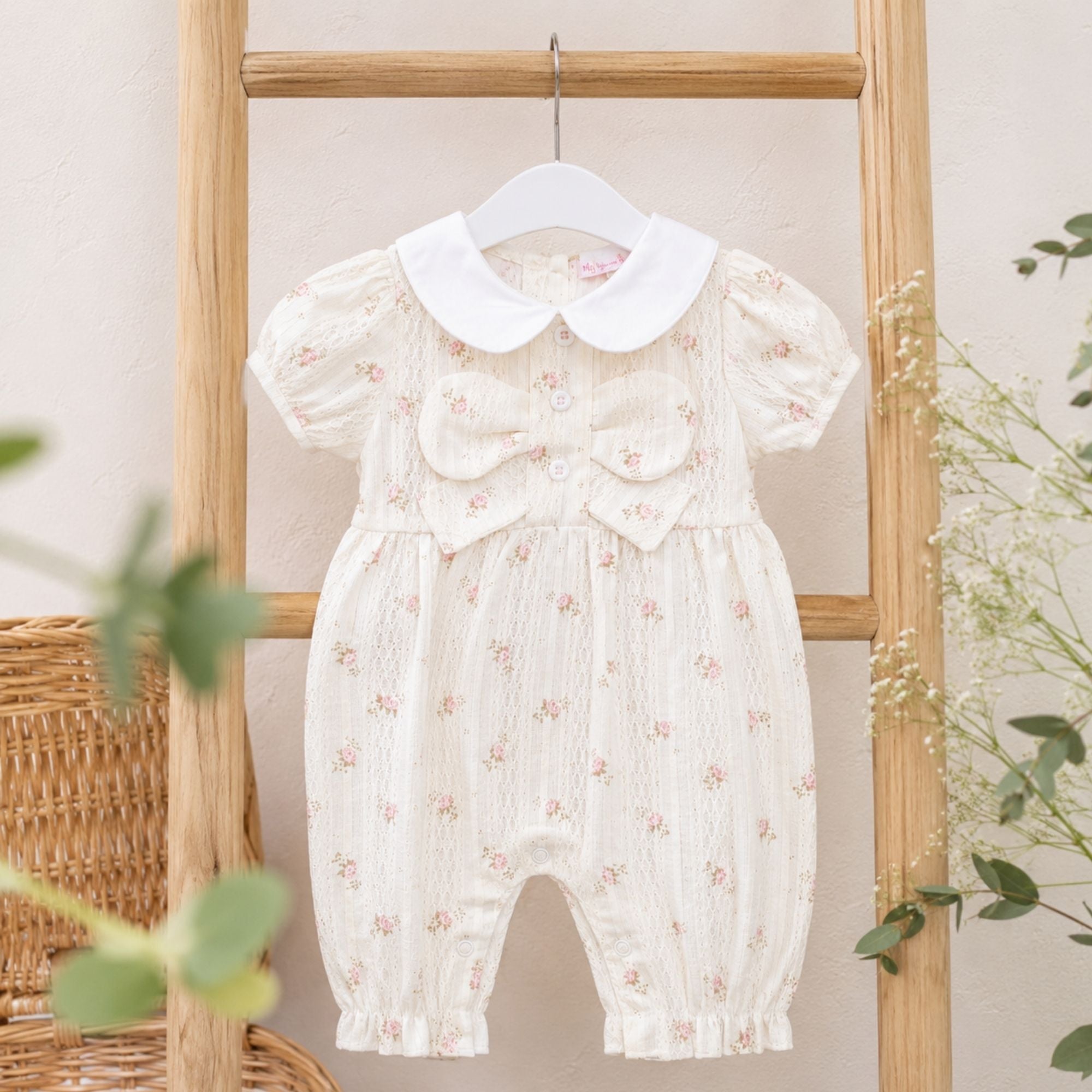 Baby girl beige floral long romper with short sleeves, white collar and bow detail