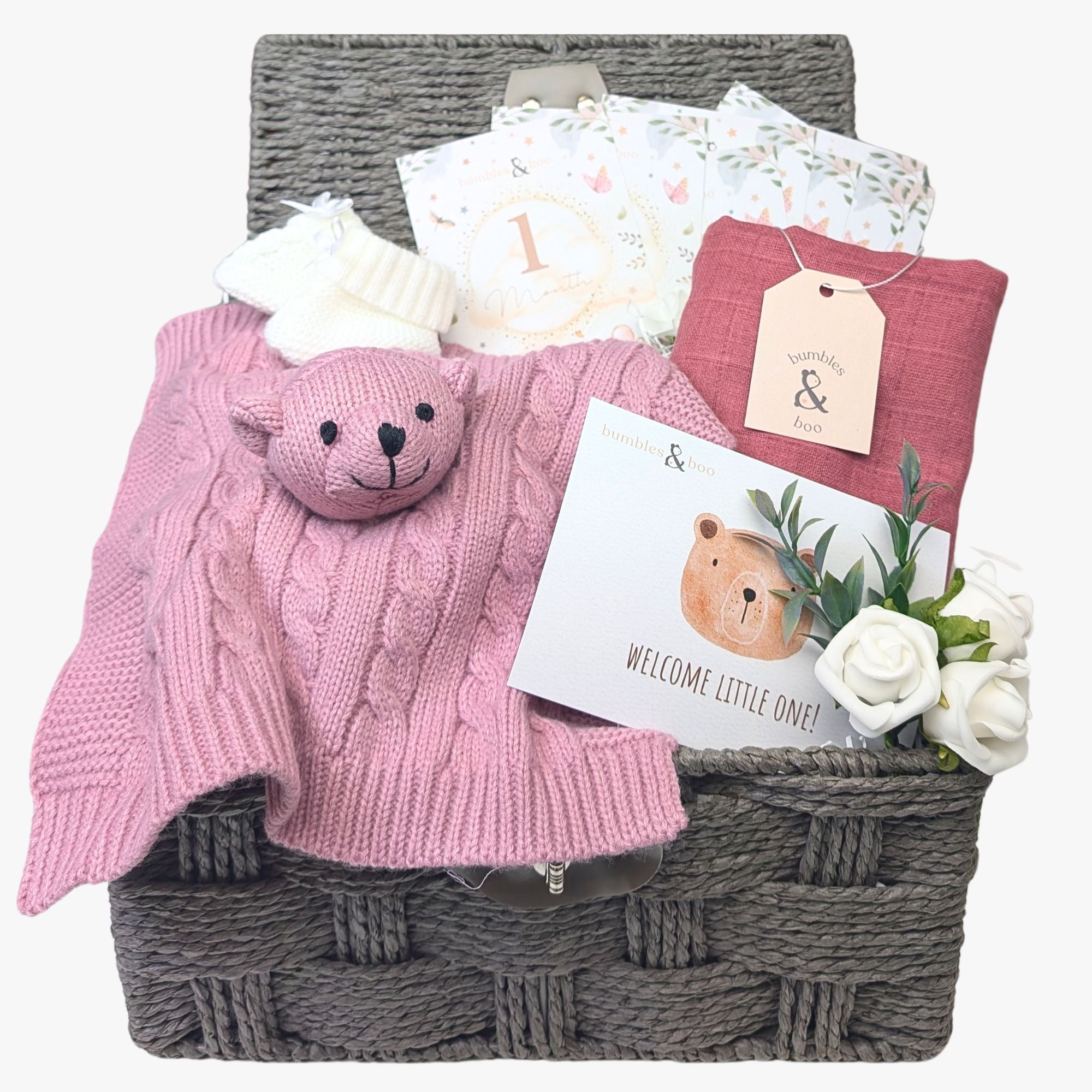 New baby girl hamper basket with dusky pink gifts and milestone cards by Bumbles and Boo.