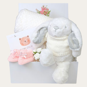 New baby girl gifts box with gifts including white bunny and blanket. Hamper designed by Bumbles and Boo.