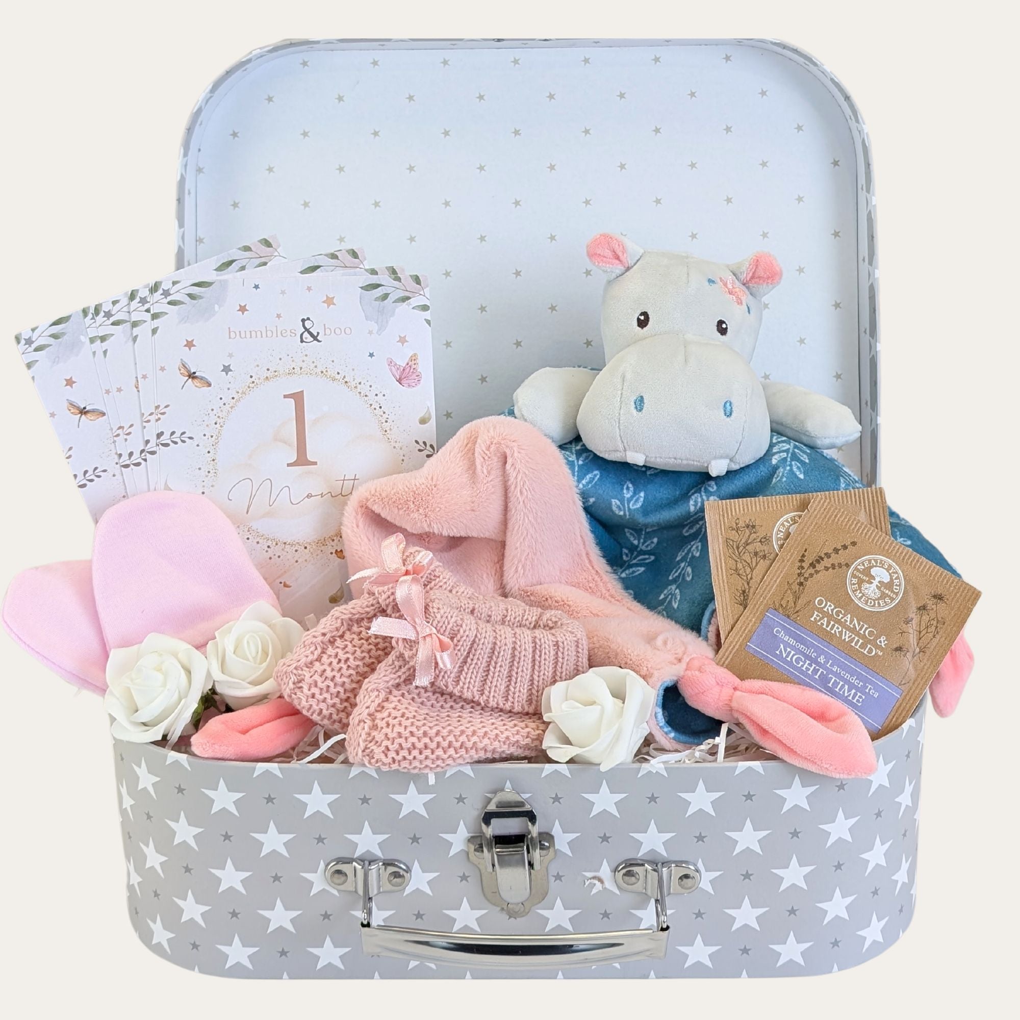 Baby girl gifts hamper with hippo baby comforter, baby booties and a treat for mum.