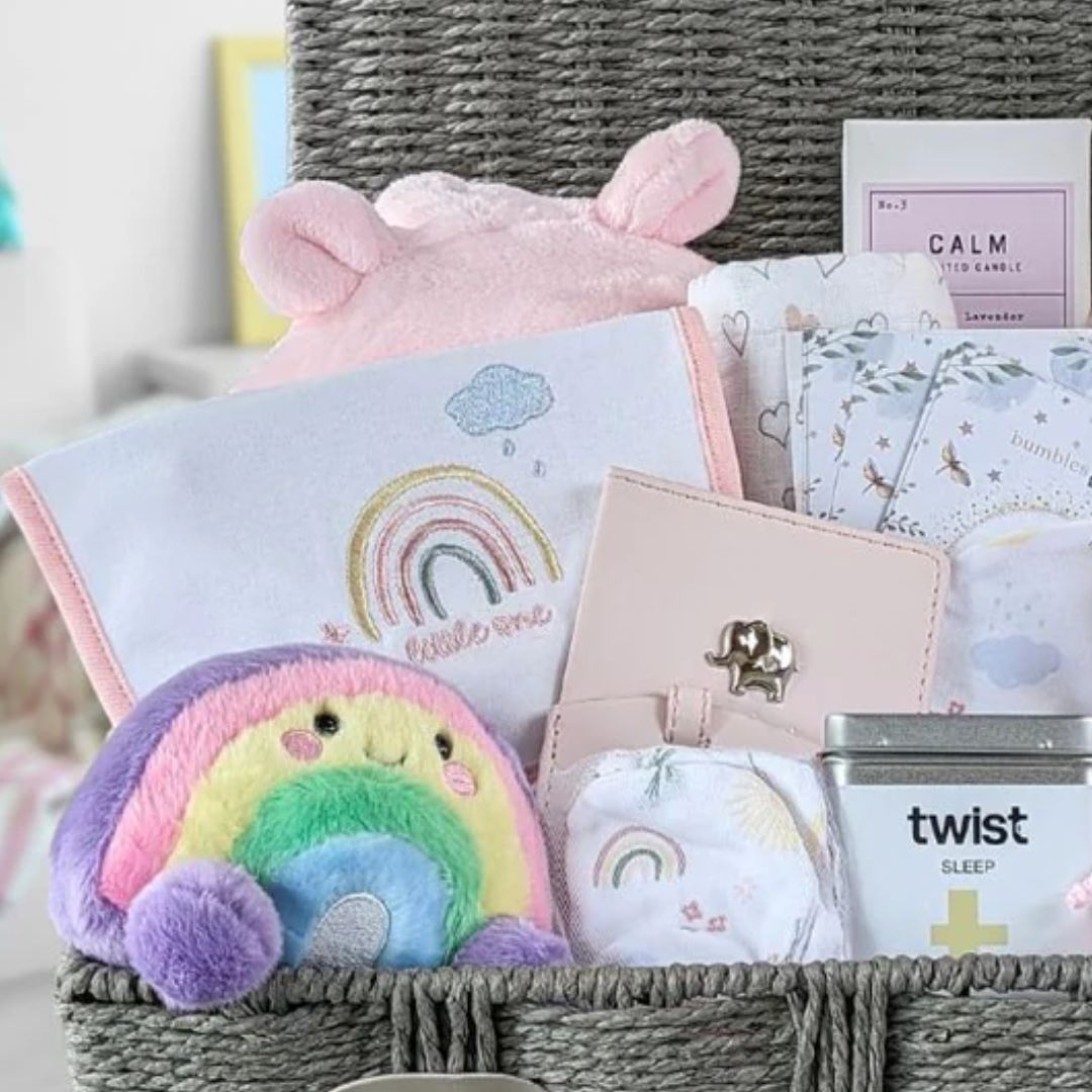 Large baby girl hamper gifts basket with bunny and clothing.