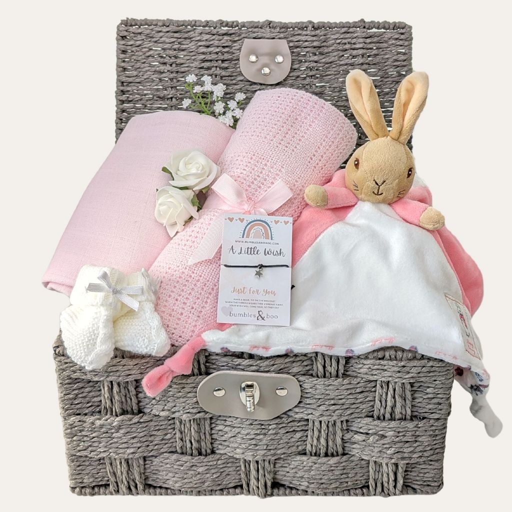 Baby girl gifts hamper basket with bunny comforter and pink cellular blanket. Bumbles and Boo.