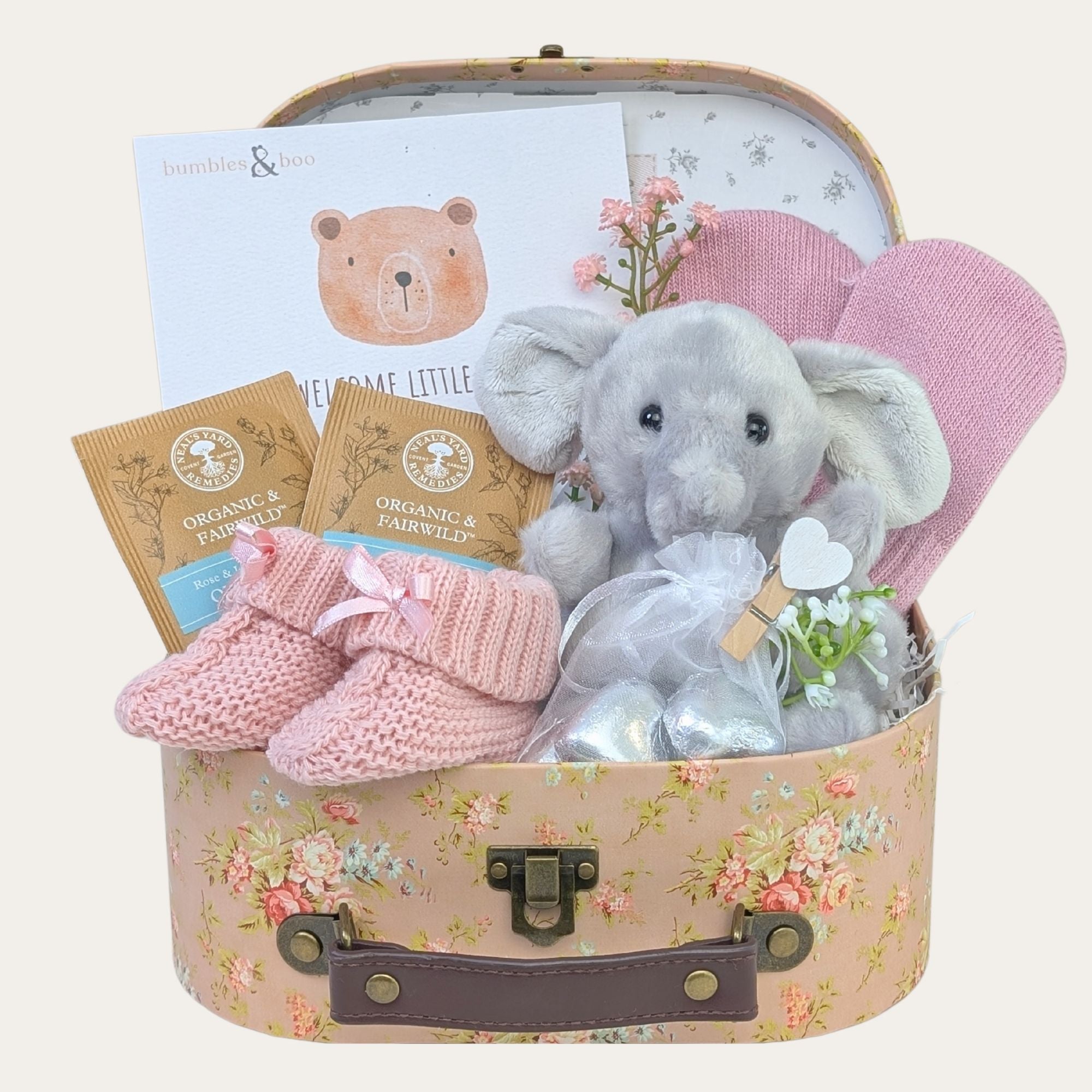 A baby girl gifts hamper with presents including elephant soft toy and chocolates for mum. Bumbles and Boo.