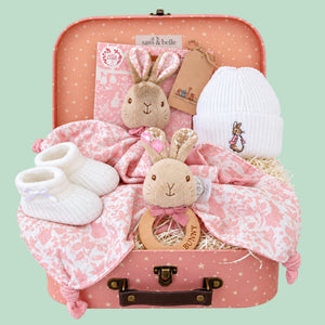 Flopsy Bunny baby girl hamper with Peter Rabbit comforter toy, knitted baby hat, booties, bunny teether and pink keepsake suitcase.