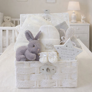 Baby Hamper Basket with gifts including grey bunny rabbit and a white blanket which can be personalised with baby's name.