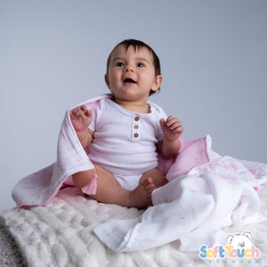 White and pink bunny printed muslin wrap with tassels â100% cotton.