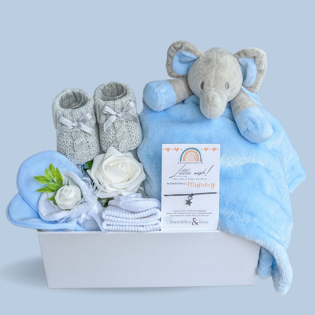baby shower gift box with blue elephant comforter.