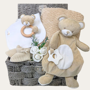 Baby shower gifts hamper basket. This Bumbles and Boo hamper includes a teddy baby comforter and beige blanket.