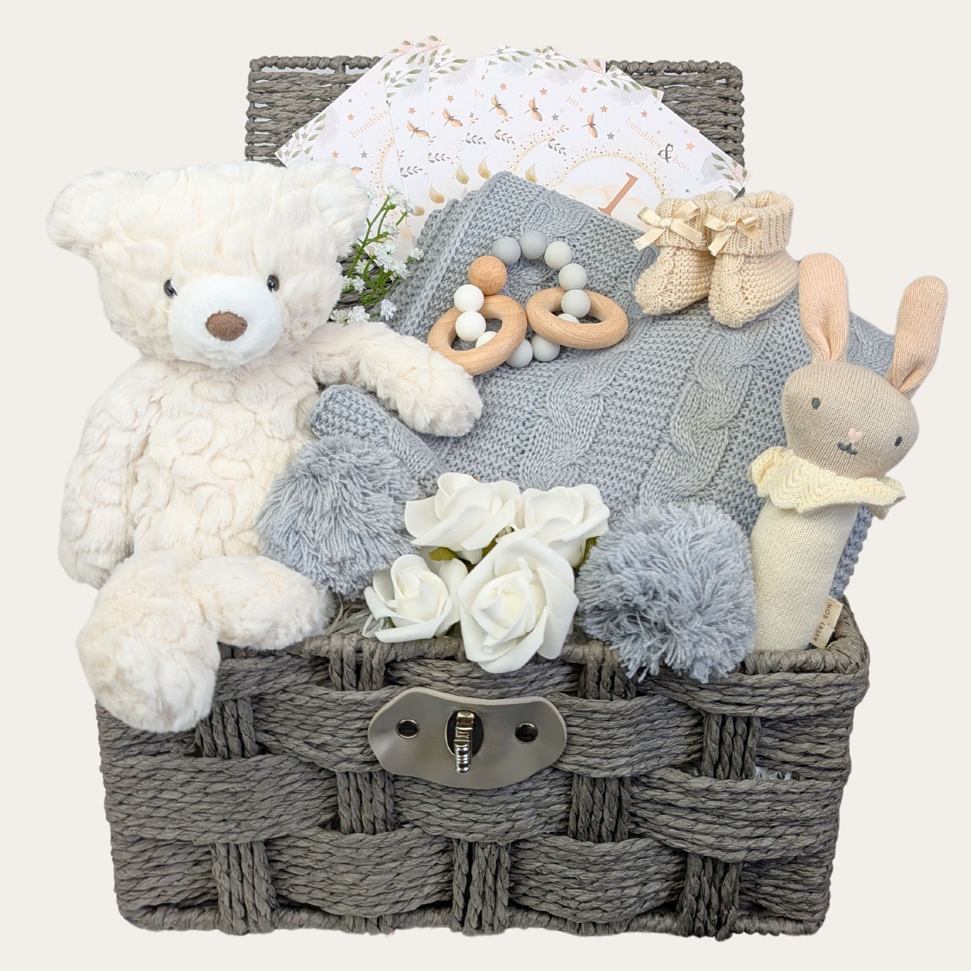 Baby shower gifts basket. This Bumbles & Boo hamper contains a white teddy and grey baby blanket.