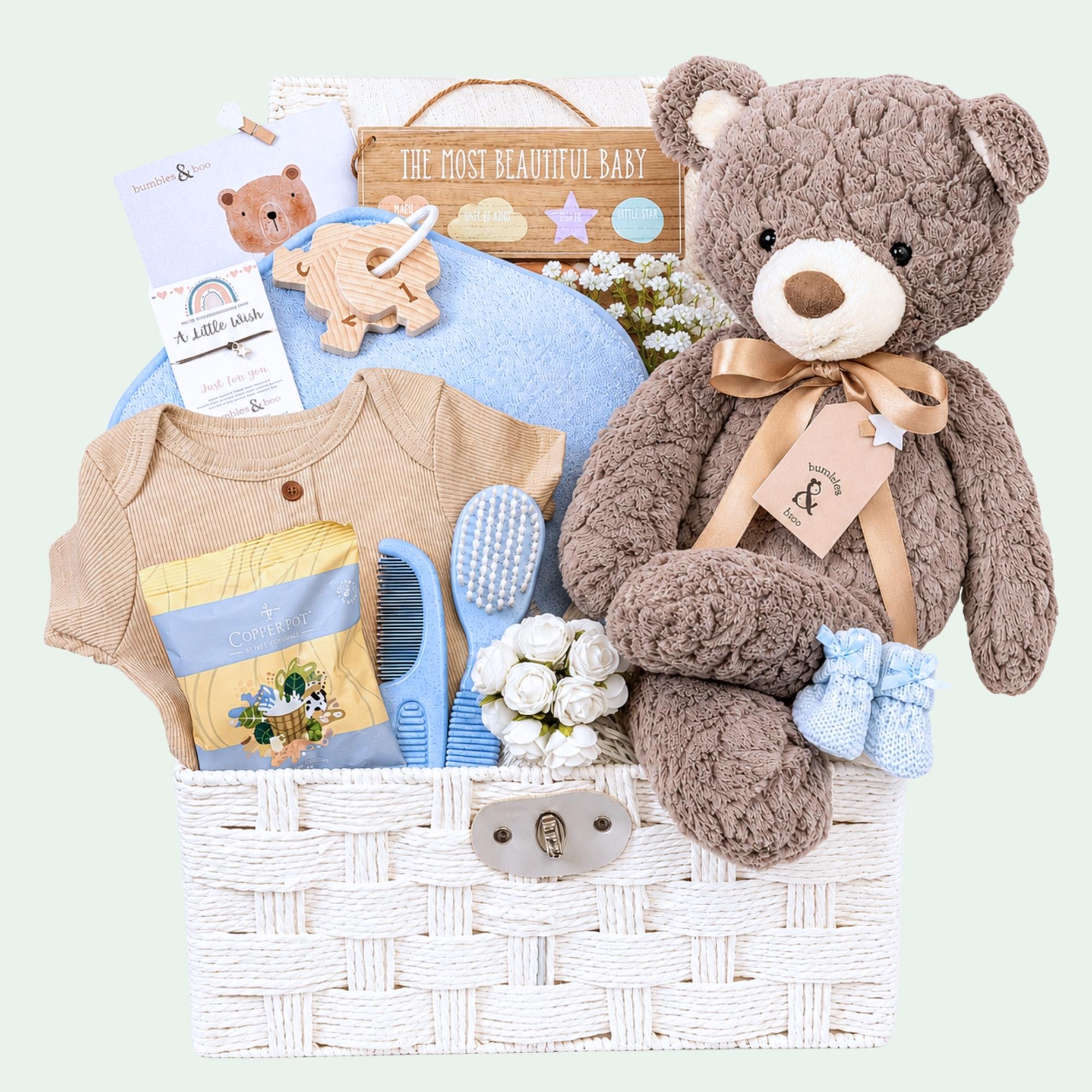 Baby shower hamper gifts with a large teddy bear and fudge for the mum to be to enjoy