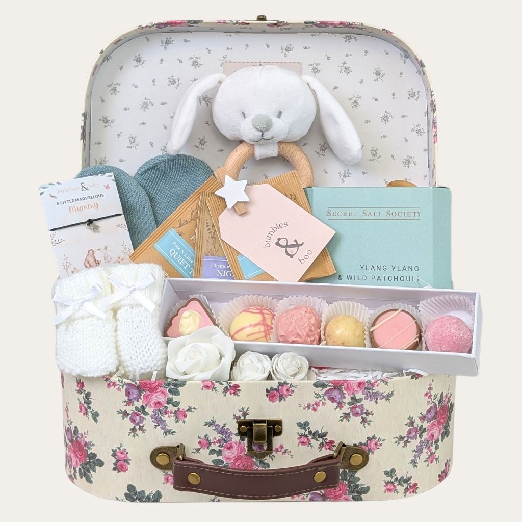 Adorable floral baby shower gifts box with sweet treats and presents for mum and baby in pink and sage green. A Bumbles and Boo gift.