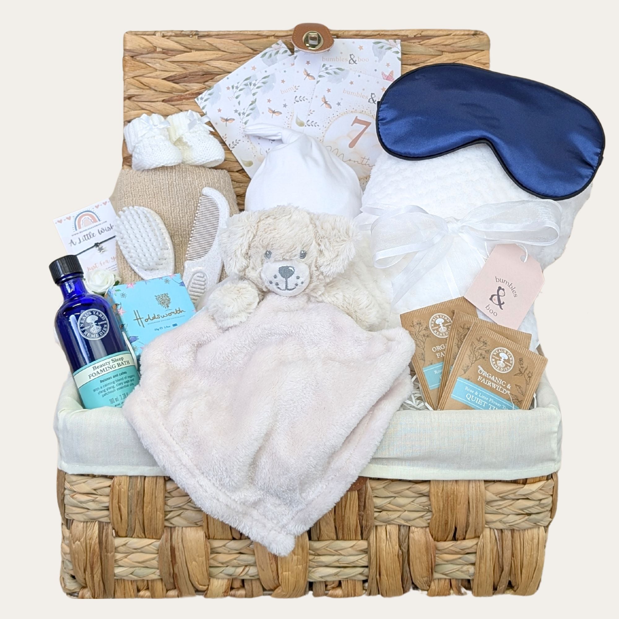 Baby shower hamper basket with Neal’s Yard gifts for mum and baby. By Bumbles and Boo.