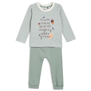 Children's outfit with striped shirt and green pants on a white background