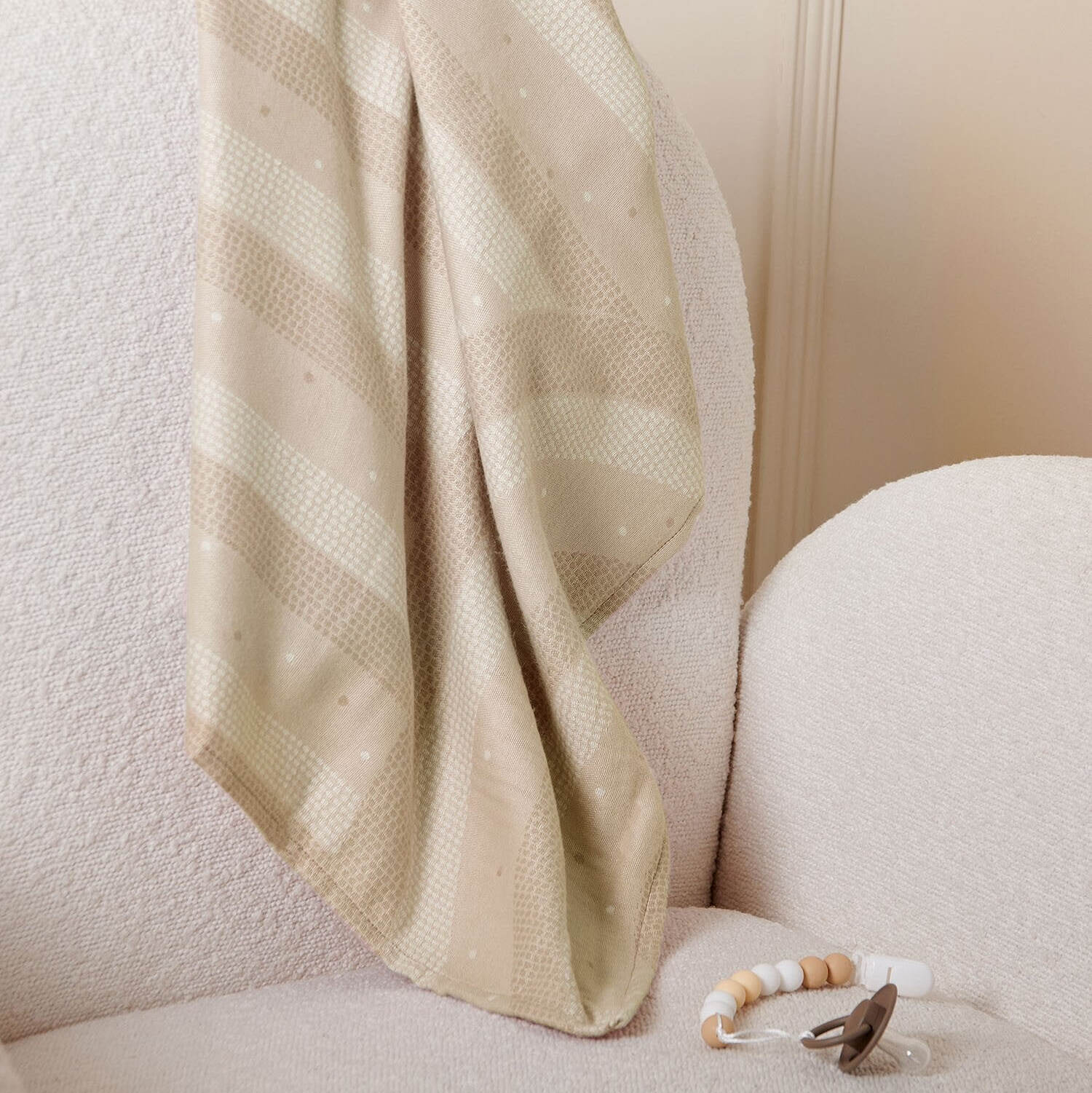 Taupe beige baby blanket from Katie Loxton with a rainbow pattern