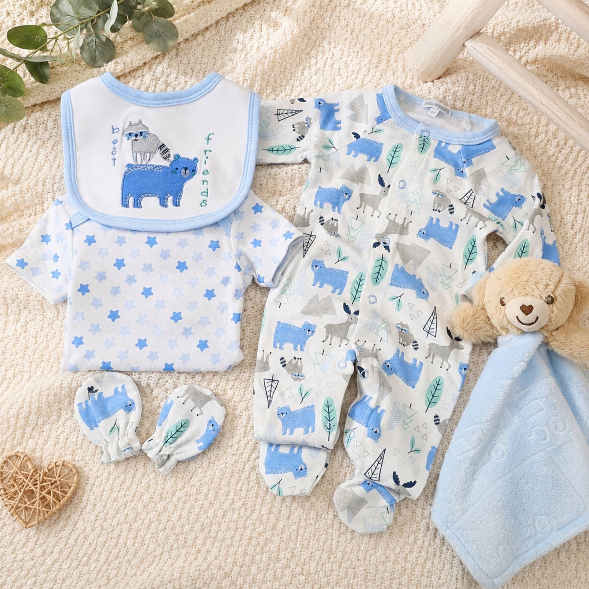 Baby boy clothing gift set in blue and white with a bear