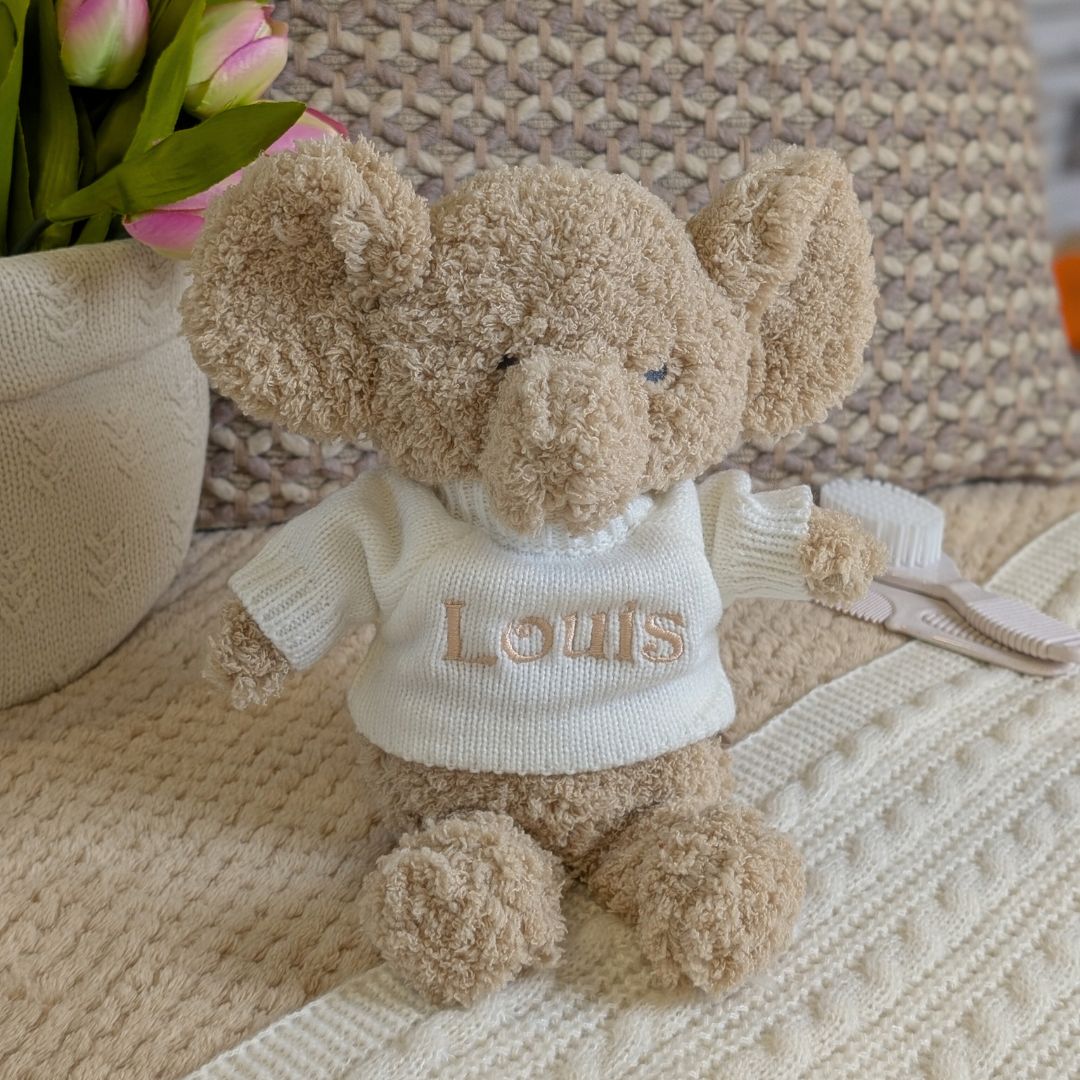 biscuit coloured elephant which can be personalised with a jumper ands embroidery.