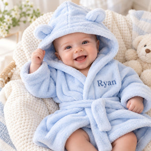 Blue personalised baby dressing gown with ears on the hood, embroidered with the name 'Ryan' to make a personalised baby gift