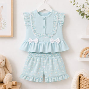 Baby girls blue woven blouse and floral shorts set with frill sleeves. Two piece baby clothes outfit shown flat on white background.