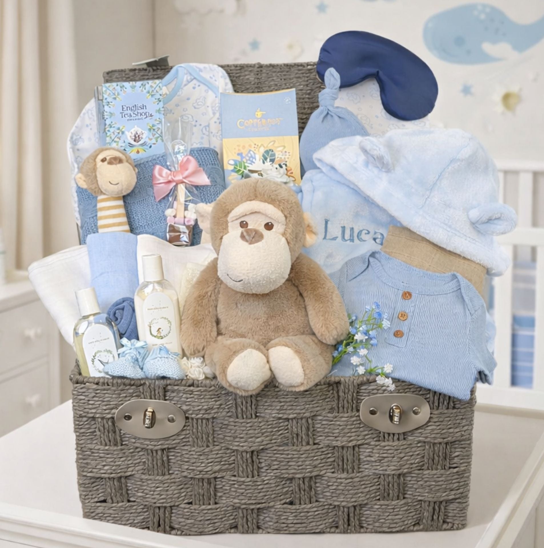 Blue monkey themed baby boy gift hamper. Soft toy and rattle with blanket and personalisation option.